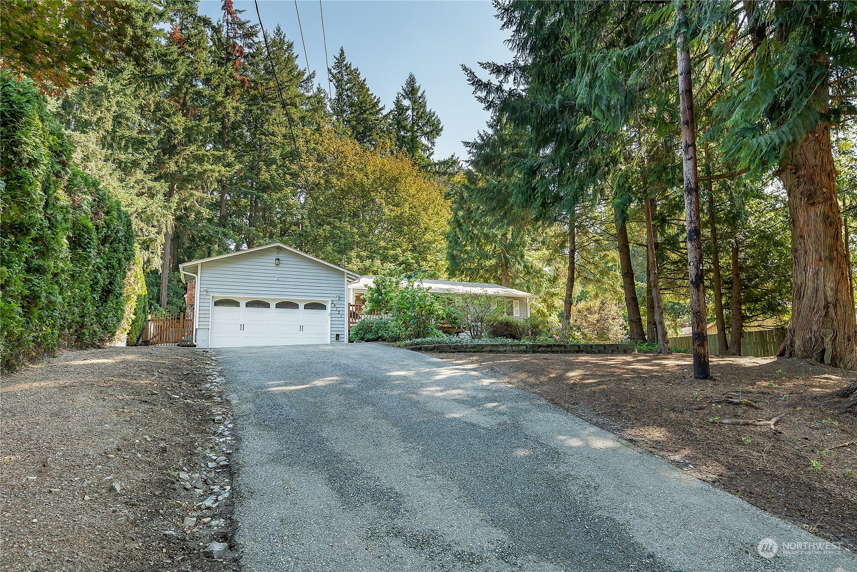 24121 6th Place West Bothell, WA 98021 - Photo 28 of 32 a view of a house with a yard and large trees