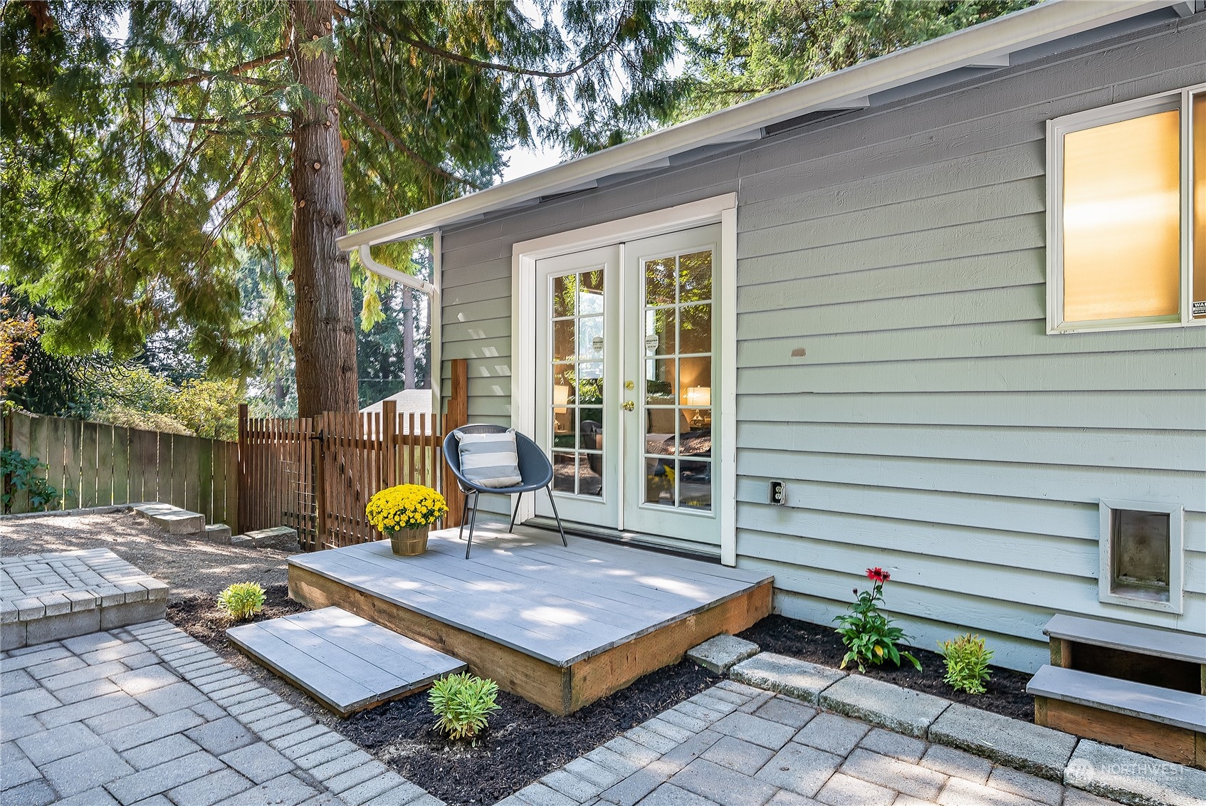 24121 6th Place West Bothell, WA 98021 - Photo 29 of 32 a view of a patio with table and chairs and potted plants