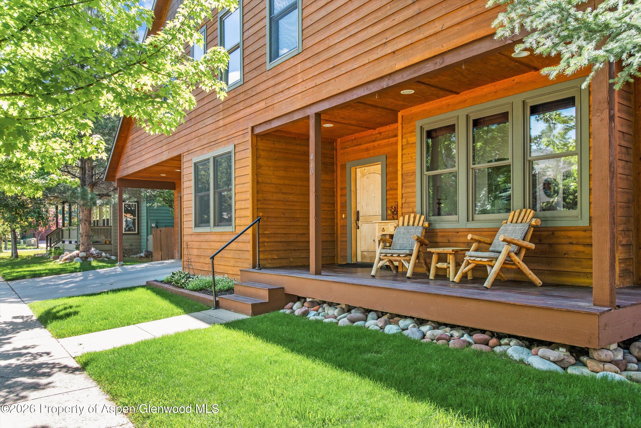 410 Meadow Court Basalt, CO 81621 - Photo 2 of 30 a view of a house with backyard porch and sitting area
