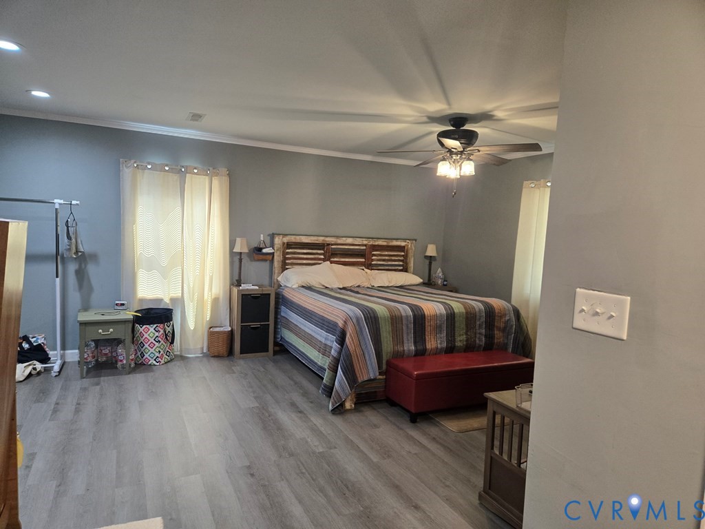 6 Mahan Road Farmville, VA 23901 - Photo 13 of 30 a bedroom with a bed and a chandelier