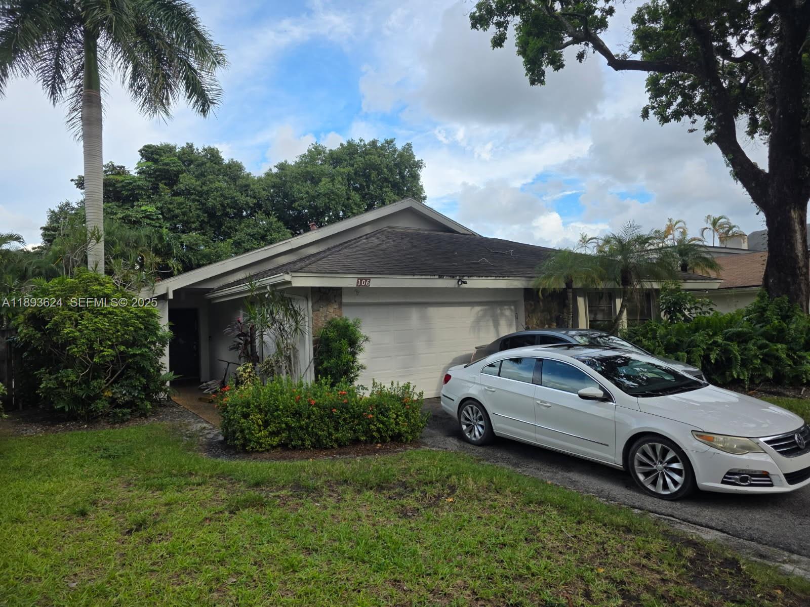 106 Kensington Road Hollywood, FL 33021 - Photo 2 of 3 a view of a car parked in front of a house