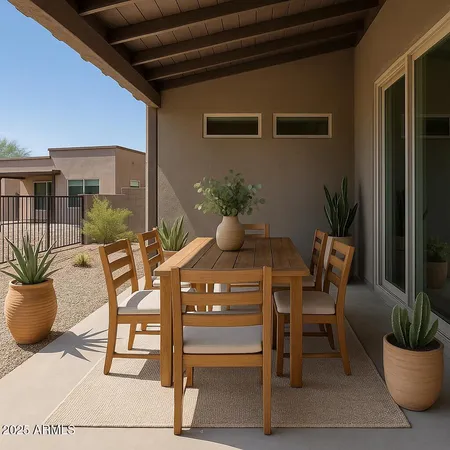 a dining room with furniture and potted plants