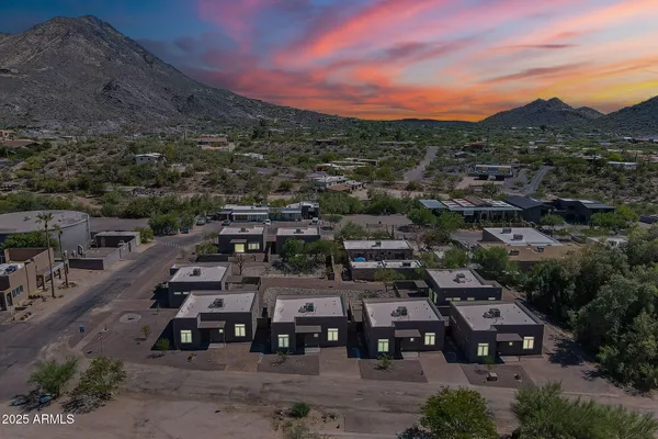 a view of a house with backyard and porch