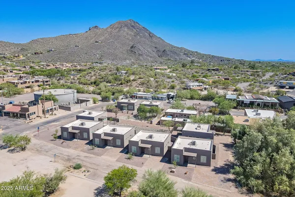 a front view of a building with sitting area