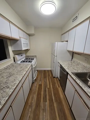 a kitchen that has a sink and a stove