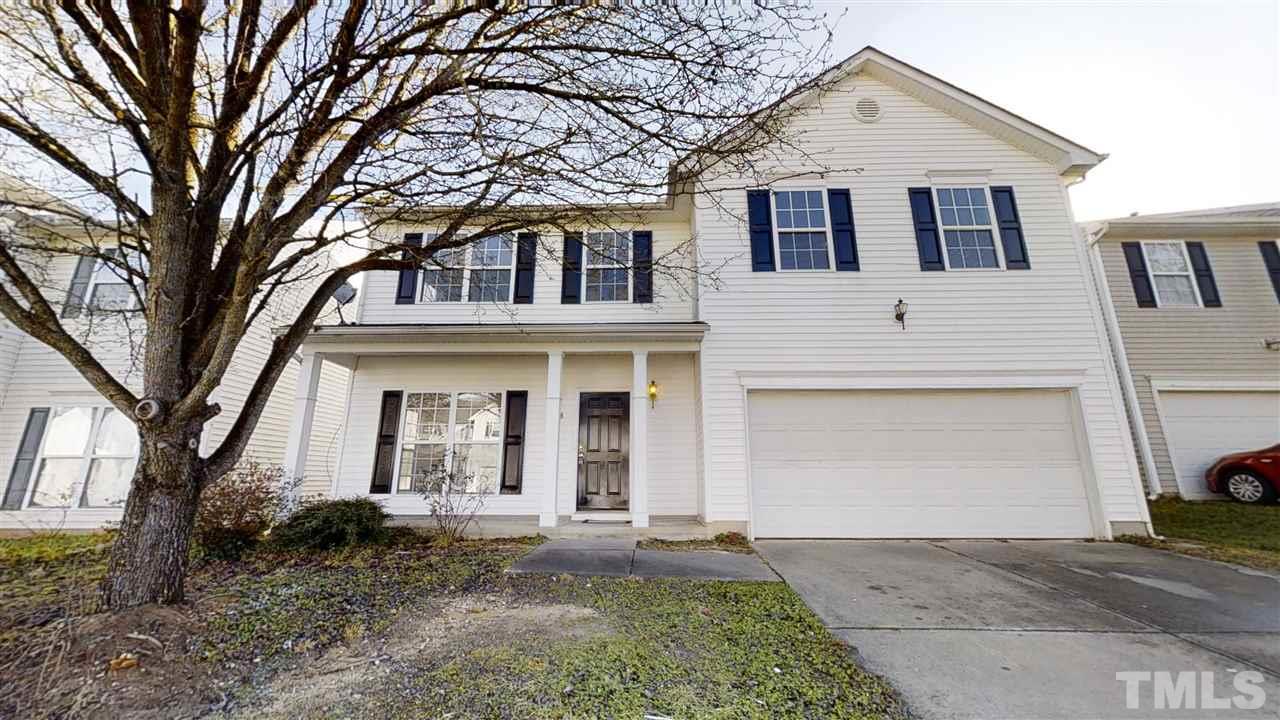 4348 Cardinal Grove Boulevard Raleigh, NC 27616 - Photo 1 of 30 a front view of a house with garden