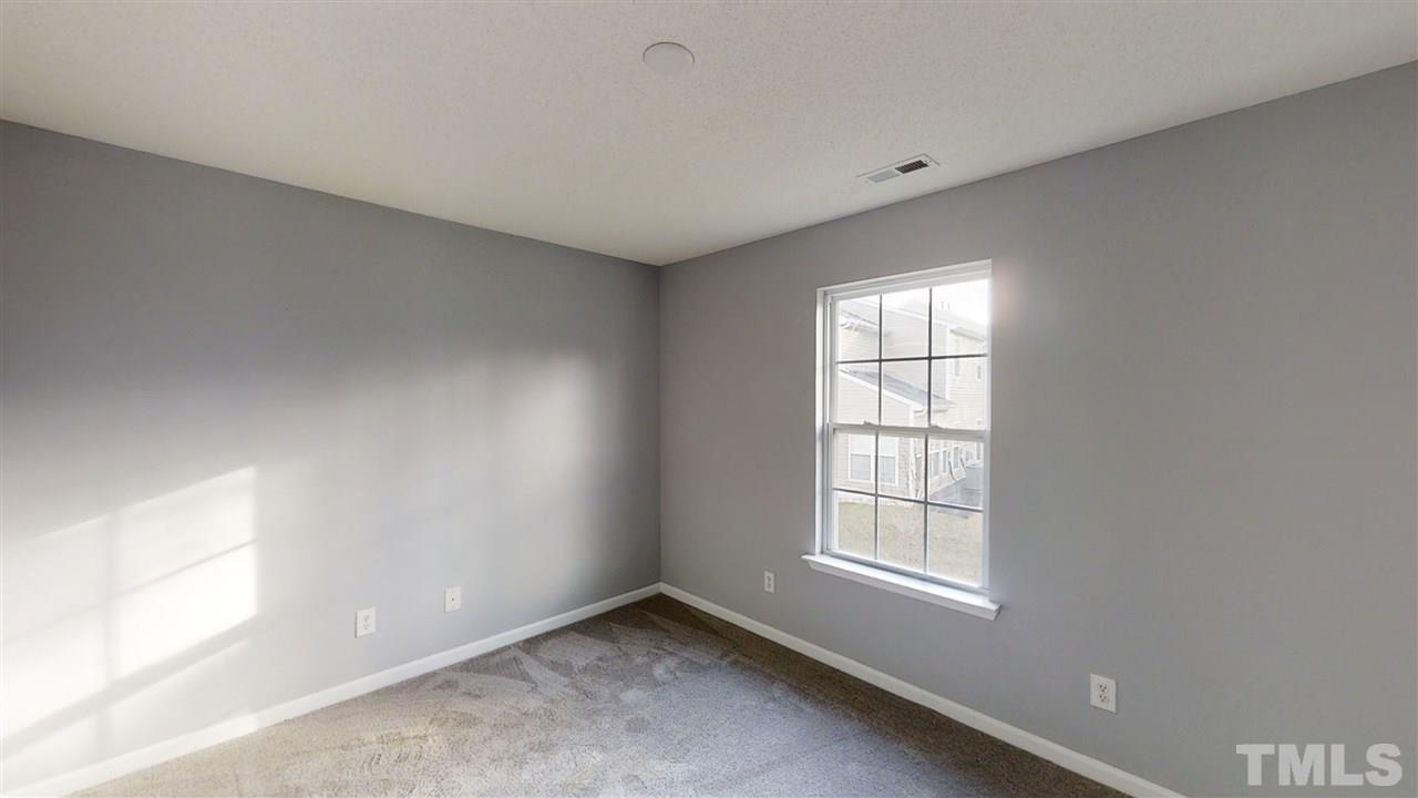 4348 Cardinal Grove Boulevard Raleigh, NC 27616 - Photo 22 of 30 a view of an empty room with a window