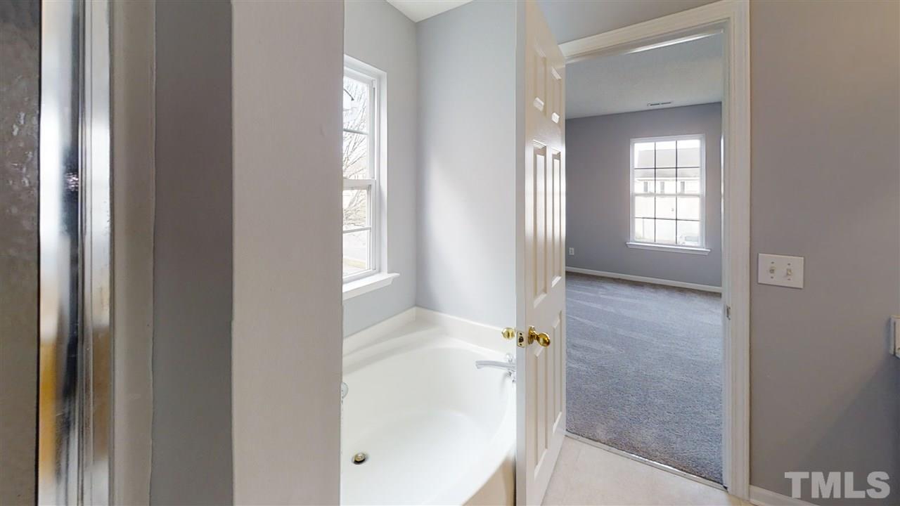 4348 Cardinal Grove Boulevard Raleigh, NC 27616 - Photo 26 of 30 a view of a bathroom from a gallery