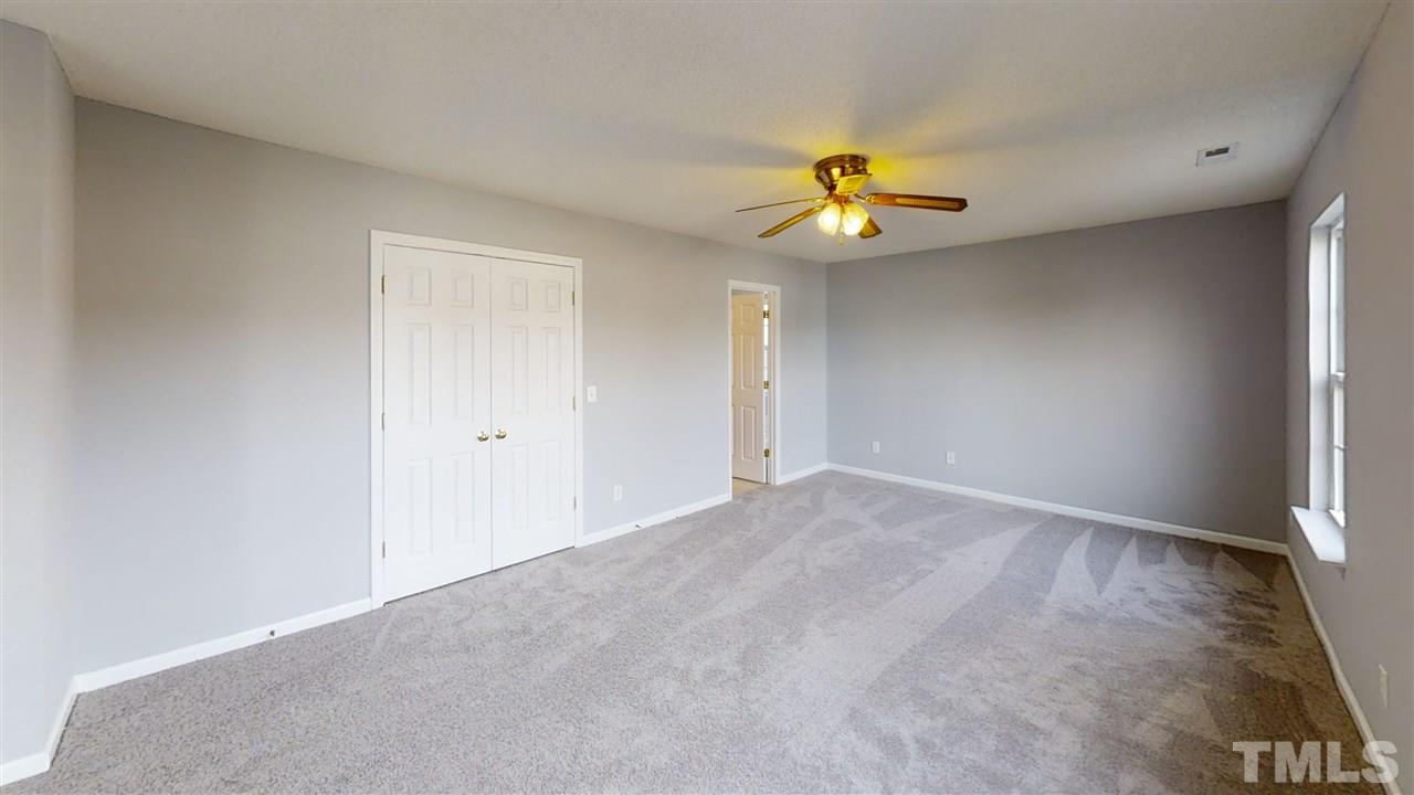 4348 Cardinal Grove Boulevard Raleigh, NC 27616 - Photo 30 of 30 a view of an empty room with a window