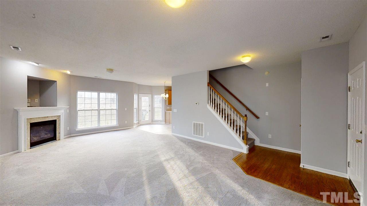 4348 Cardinal Grove Boulevard Raleigh, NC 27616 - Photo 8 of 30 a view of an empty room with fireplace and a window