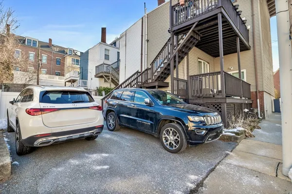 a car parked in front of a house