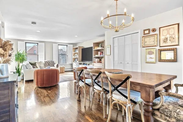 a view of a livingroom with furniture and a table