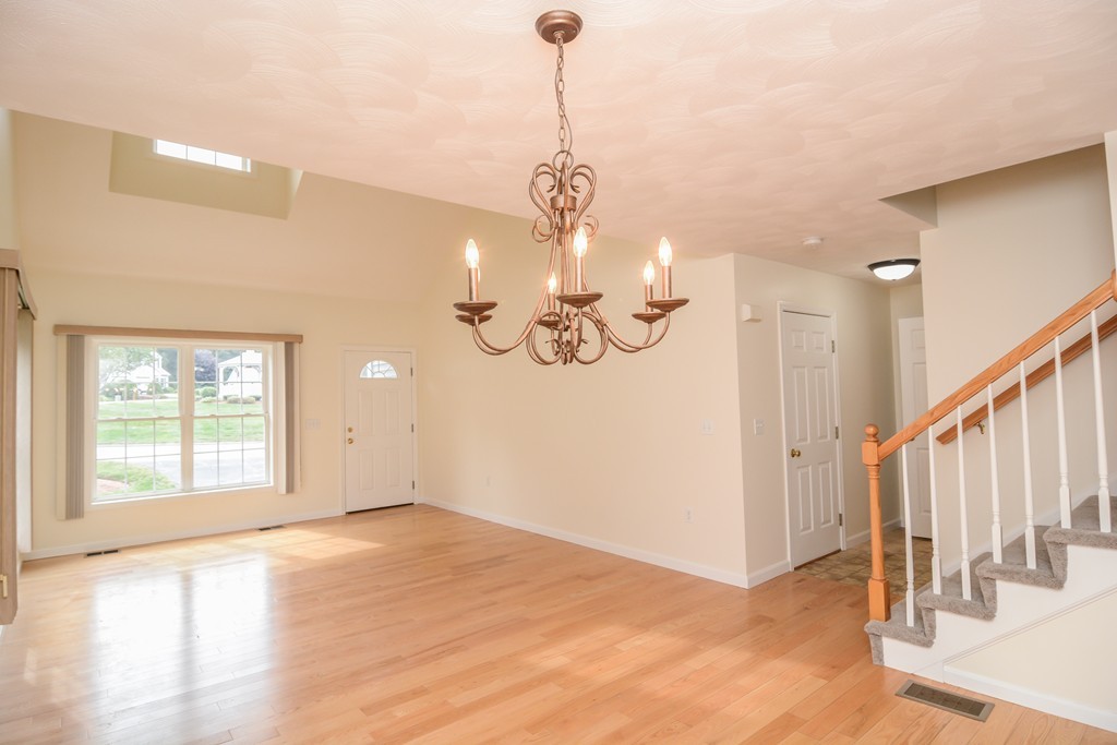 35 Hadleigh Road, Unit 35 Windham, NH 03087 - Photo 11 of 39 a view of an empty room with wooden floor and a window
