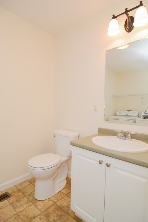 35 Hadleigh Road, Unit 35 Windham, NH 03087 - Photo 18 of 39 a bathroom with a sink toilet and mirror