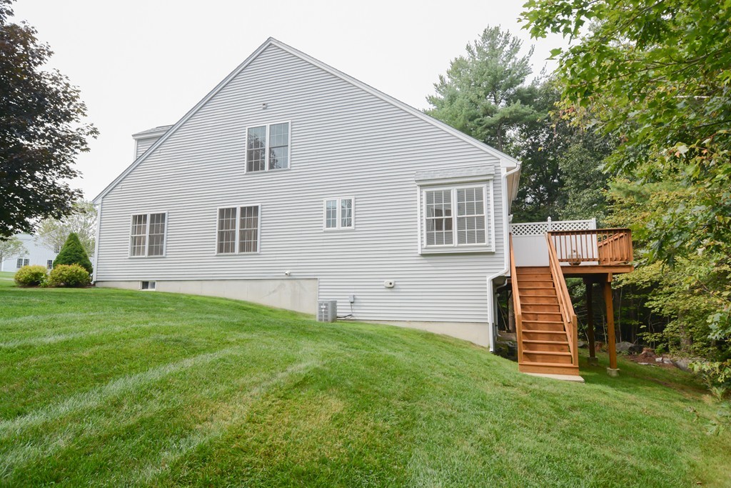 35 Hadleigh Road, Unit 35 Windham, NH 03087 - Photo 2 of 39 a front view of a house with a garden