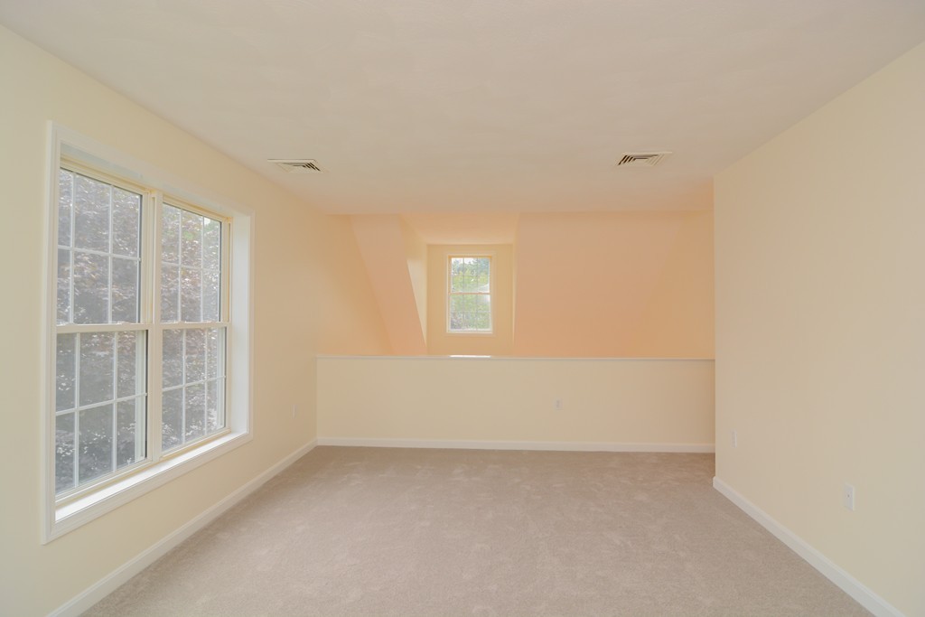 35 Hadleigh Road, Unit 35 Windham, NH 03087 - Photo 26 of 39 a view of an empty room with a window