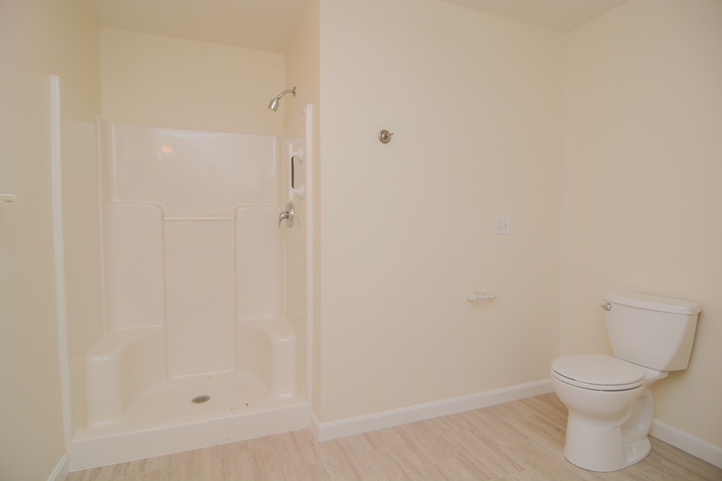 35 Hadleigh Road, Unit 35 Windham, NH 03087 - Photo 31 of 39 a bathroom with a toilet and a shower