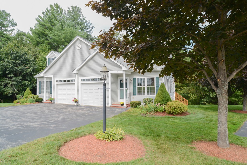 35 Hadleigh Road, Unit 35 Windham, NH 03087 - Photo 8 of 39 a view of a house with a yard and potted plants