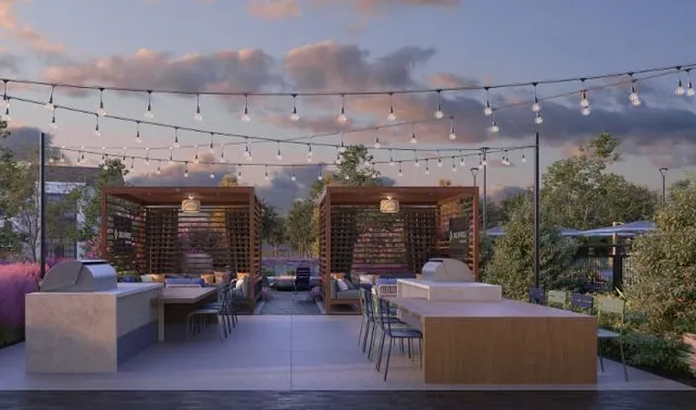 a patio with patio a couch and potted plants