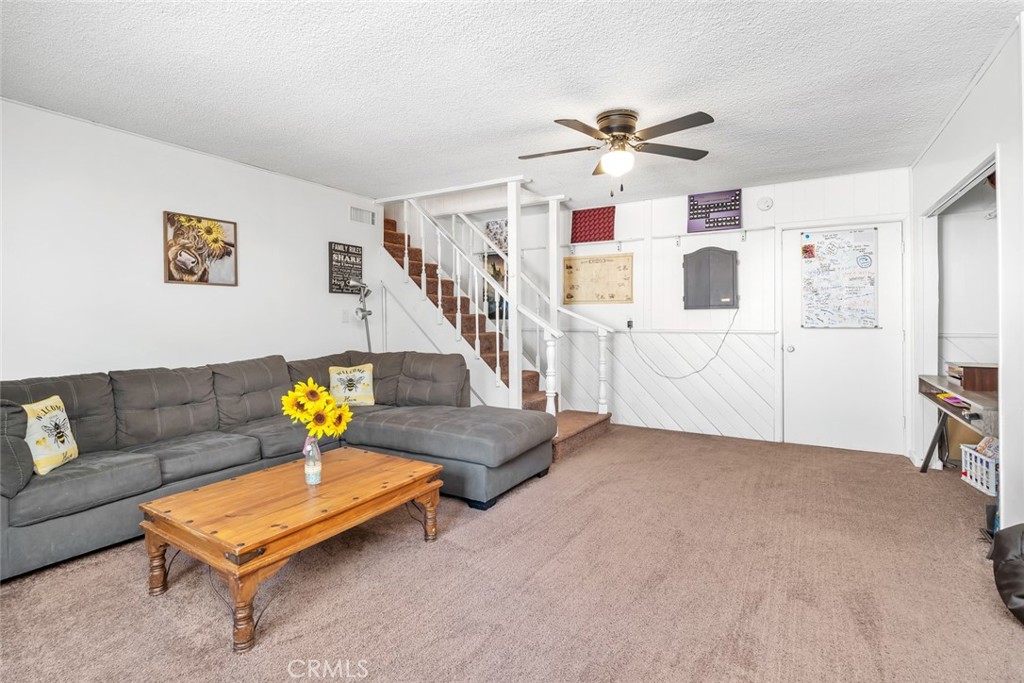 245 Mountain Shadow Road Wofford Heights, CA 93285 - Photo 17 of 72 a living room with furniture and stairs