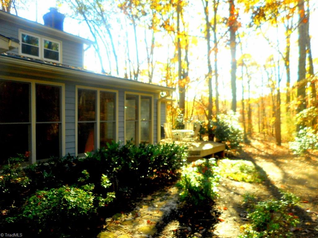 8541 Linville Road Oak Ridge, NC 27310 - Photo 2 of 29 Front view towards side deck