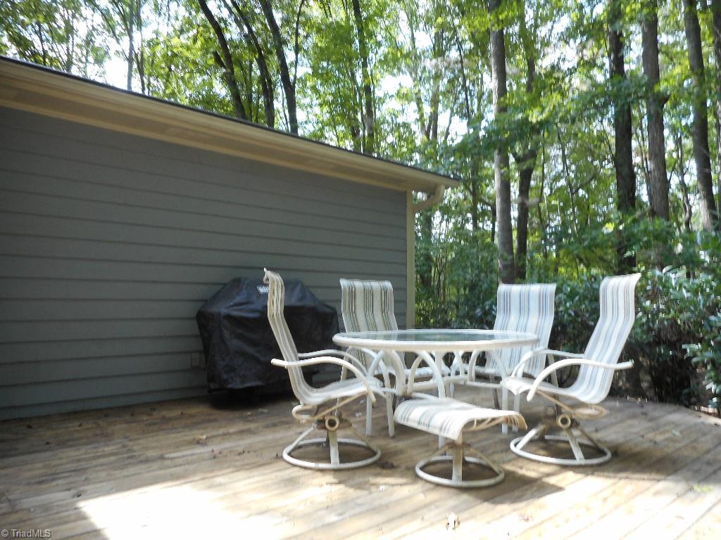 8541 Linville Road Oak Ridge, NC 27310 - Photo 3 of 29 Cook out on the side deck and enjoy the peace and tranquilty