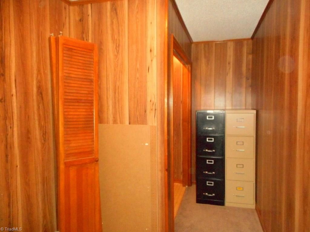 8541 Linville Road Oak Ridge, NC 27310 - Photo 21 of 29 2nd floor laundry with storage area