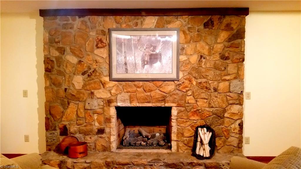 8541 Linville Road Oak Ridge, NC 27310 - Photo 7 of 29 Custom stone fireplace in cozy den (being used as an office)