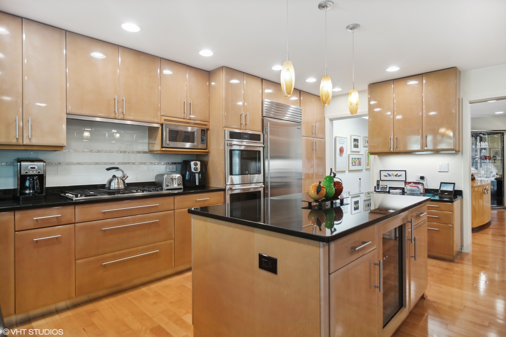 3134 Temple Lane Wilmette, IL 60091 - Photo 6 of 32 a kitchen with kitchen island granite countertop a sink and cabinets