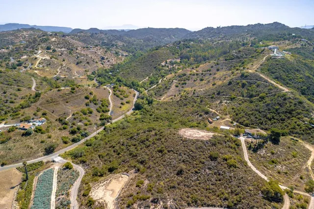 a view of a city with mountains in the background