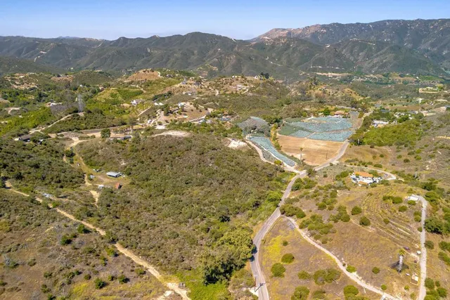 a view of a yard with a mountain