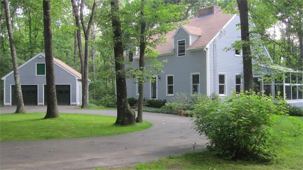 89 Scribner Road Tyngsborough, MA 01879 - Photo 1 of 30 a front view of a house with a yard and trees