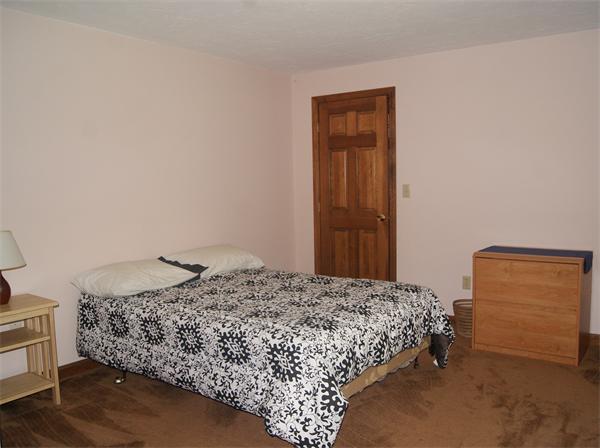 89 Scribner Road Tyngsborough, MA 01879 - Photo 24 of 30 a bedroom with a bed and a dresser