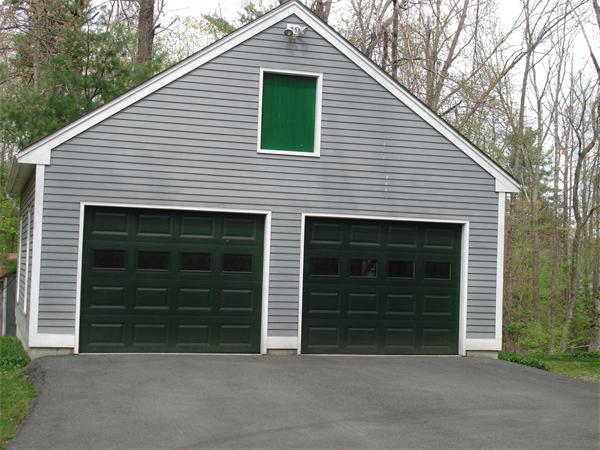 89 Scribner Road Tyngsborough, MA 01879 - Photo 29 of 30 a front view of a house with a yard and garage