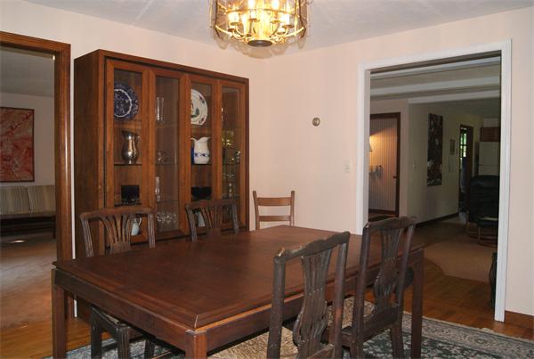 89 Scribner Road Tyngsborough, MA 01879 - Photo 6 of 30 a view of a dining room with furniture and chandelier