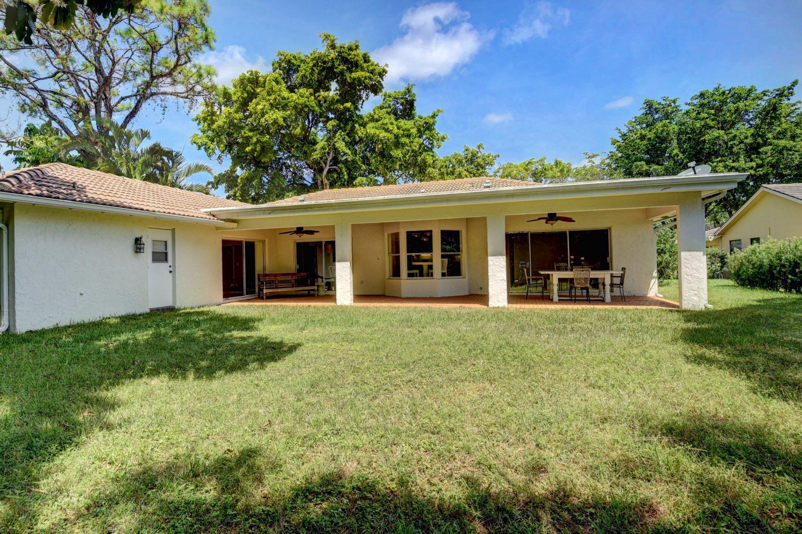 2422 Northwest 36th Street Boca Raton, FL 33431 - Photo 16 of 45 Huge 42' long covered porch