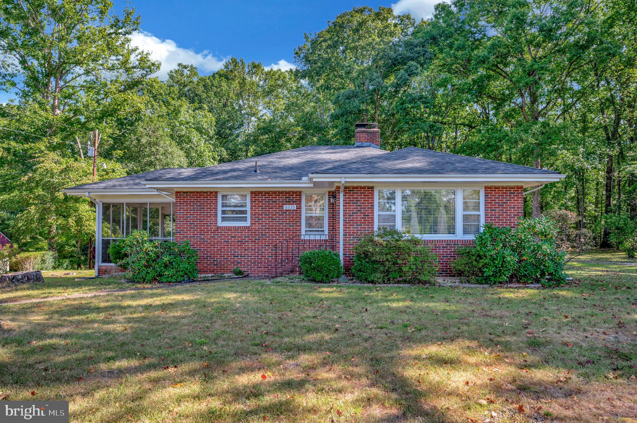 8625 Brock Road Spotsylvania, VA 22553 - Photo 1 of 47 Charming brick home nestled in lush greenery.
