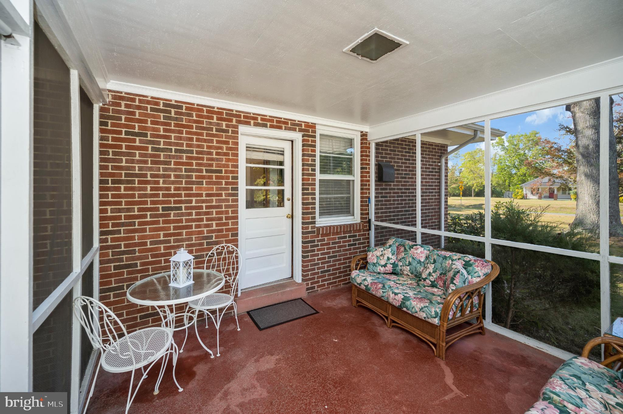 8625 Brock Road Spotsylvania, VA 22553 - Photo 24 of 47 Charming screened porch for serene moments.