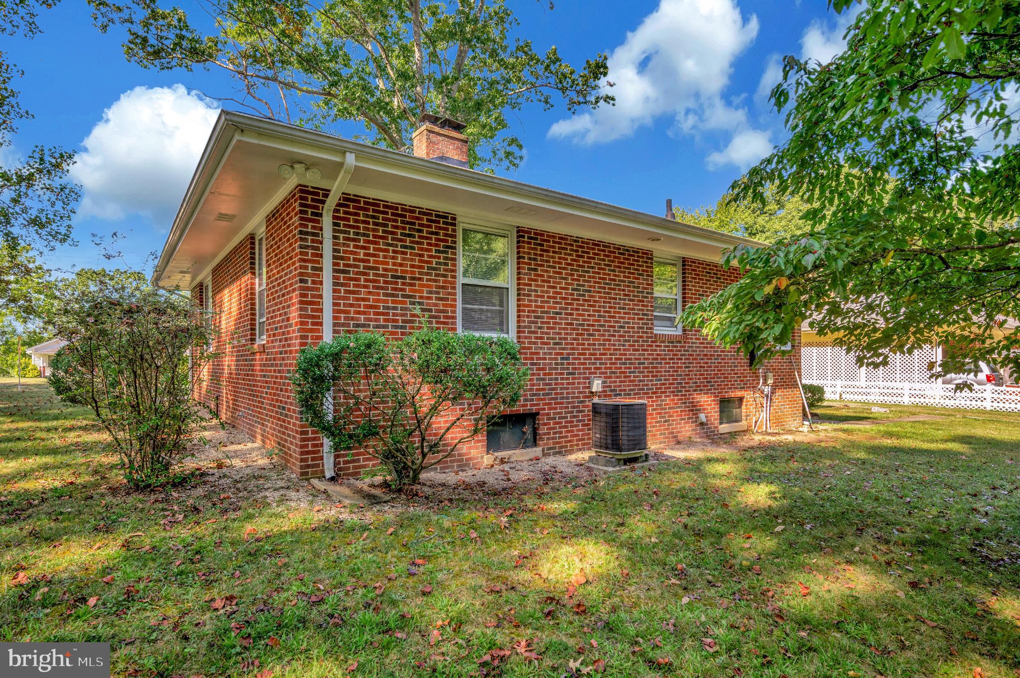 8625 Brock Road Spotsylvania, VA 22553 - Photo 45 of 47 Charming brick home nestled in lush greenery.