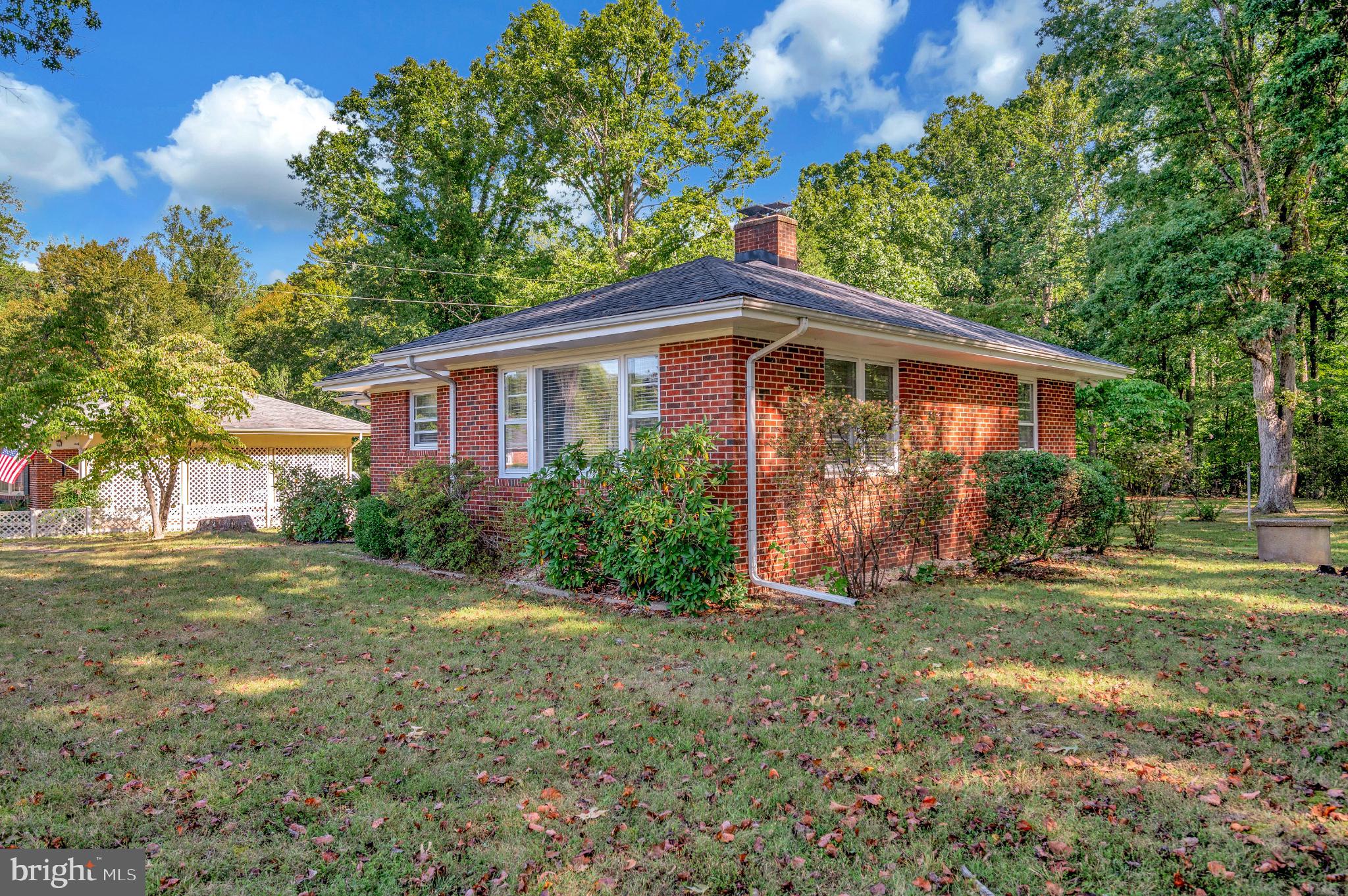 8625 Brock Road Spotsylvania, VA 22553 - Photo 46 of 47 Charming brick home nestled in lush greenery.