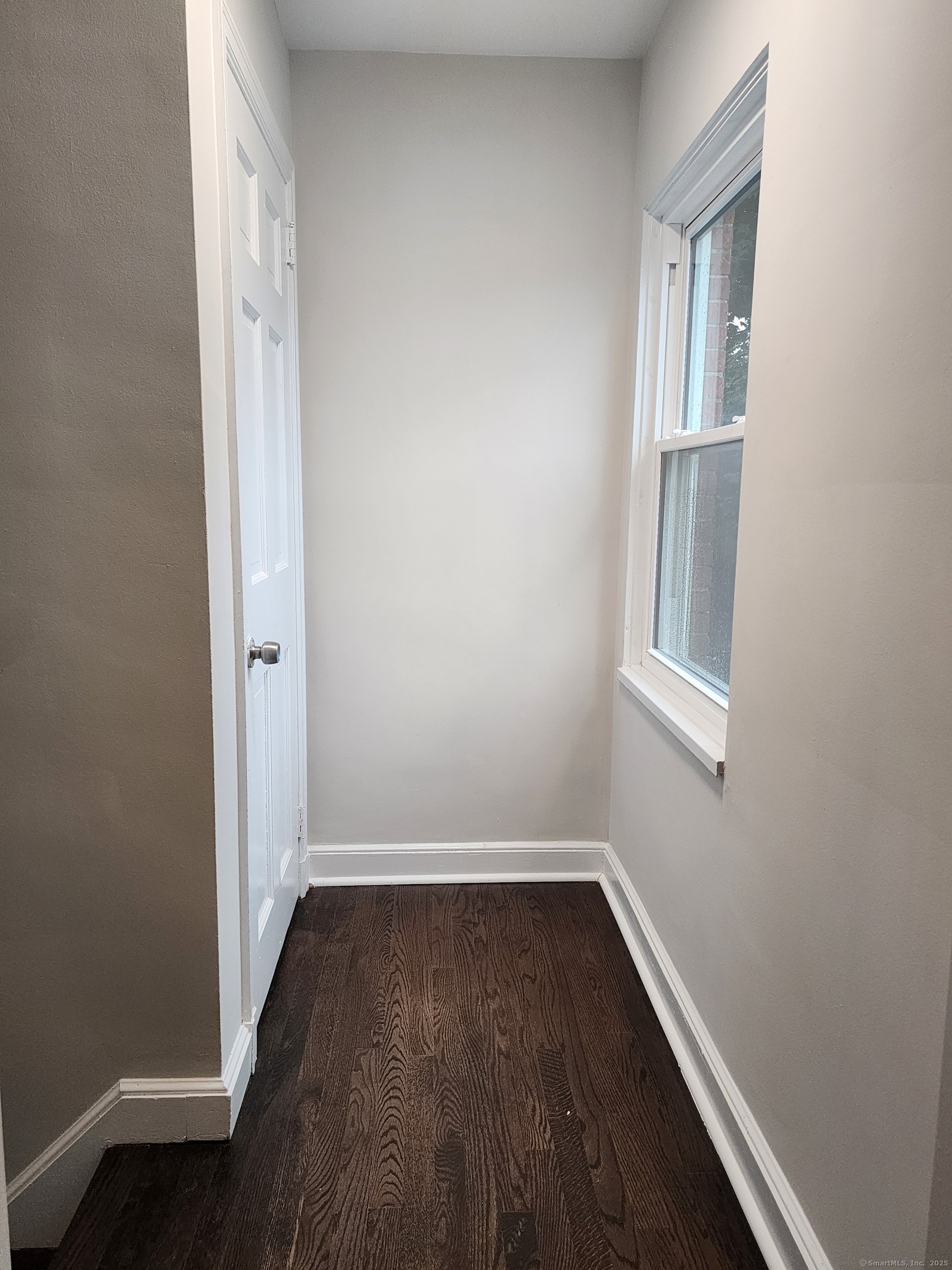 17 Shoreham Terrace Fairfield, CT 06824 - Photo 13 of 13 wooden floor and window in an empty room