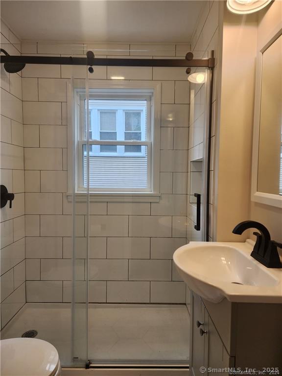 17 Shoreham Terrace Fairfield, CT 06824 - Photo 5 of 13 a bathroom with a sink and mirror