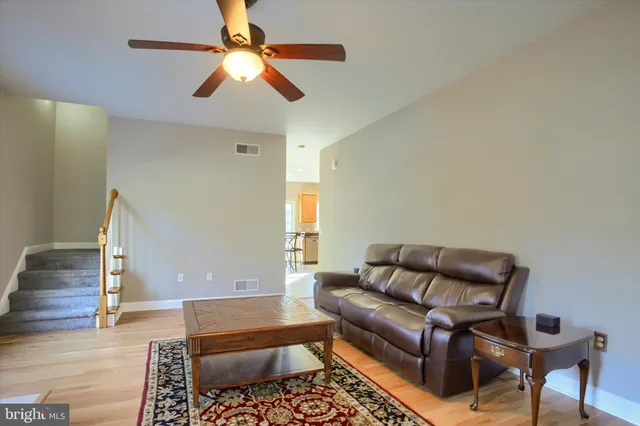 a living room with furniture and a rug