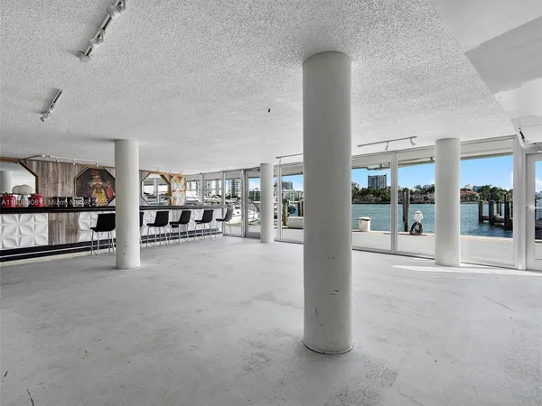 a room with lots of furniture and pool table