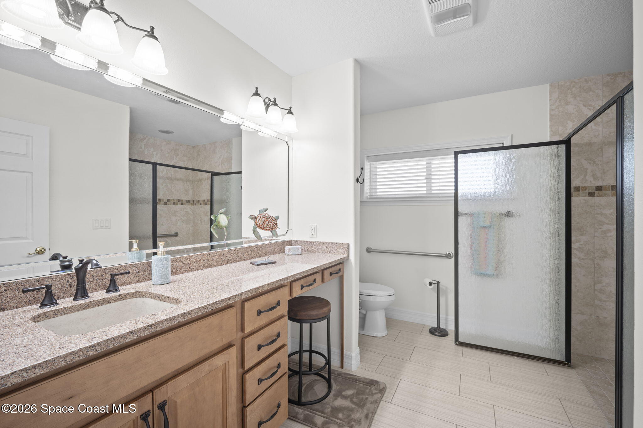 3125 Davis Road Mims, FL 32754 - Photo 35 of 47 a bathroom with a double vanity sink a mirror and a shower