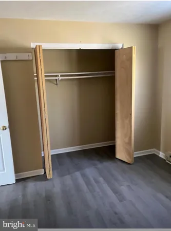 an empty room with wooden floor