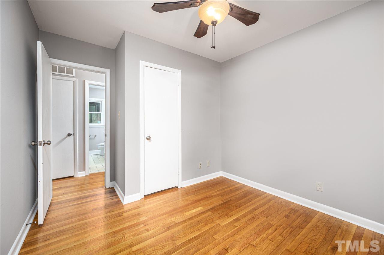 4608 Revere Road Durham, NC 27713 - Photo 14 of 29 wooden floor in an empty room with a window