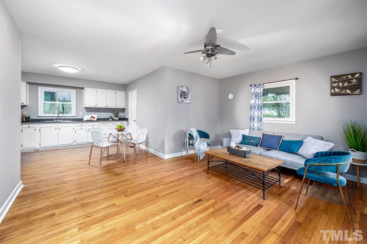 4608 Revere Road Durham, NC 27713 - Photo 3 of 29 a living room with furniture and wooden floor