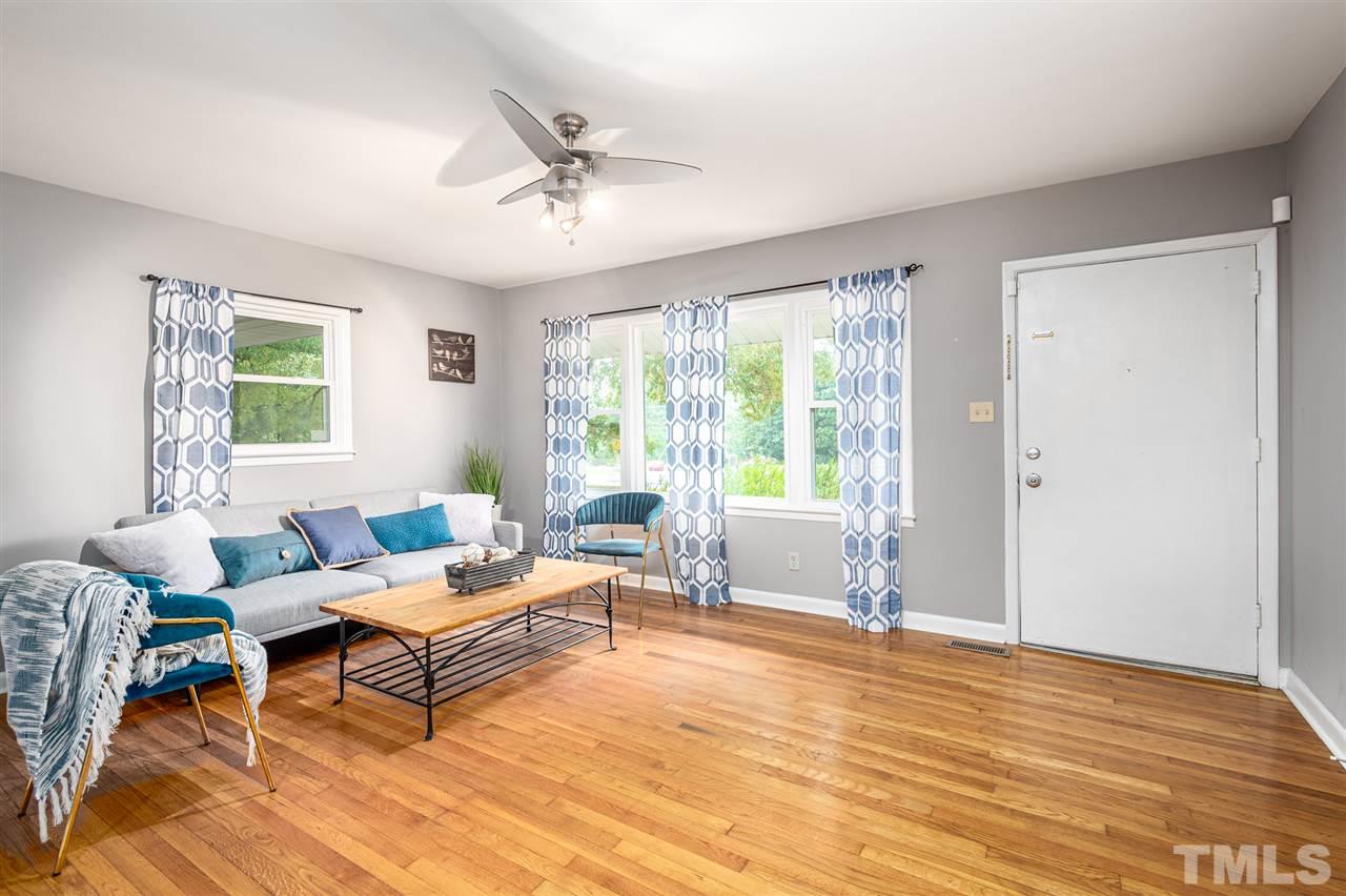 4608 Revere Road Durham, NC 27713 - Photo 4 of 29 a living room with furniture and a large window