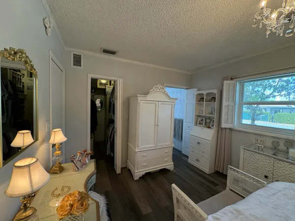 a bedroom with furniture and a window
